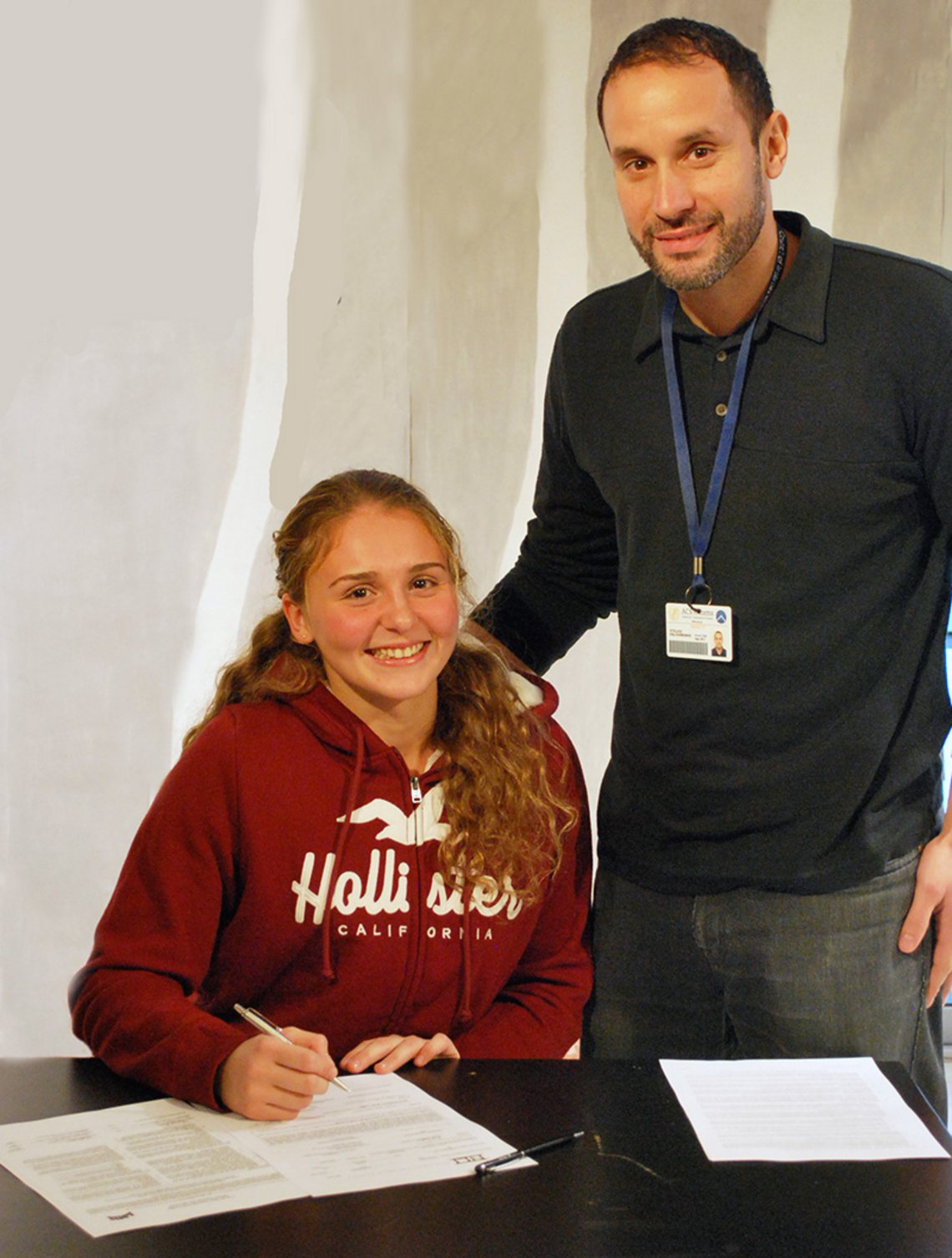 Alexandra with her counselor Stelios Kalogridakis signing the Letter of Intent 